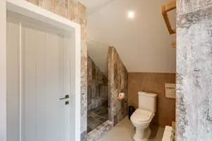 Stylish Knoxville bathroom remodel with glass shower, updated flooring, and contemporary design elements.